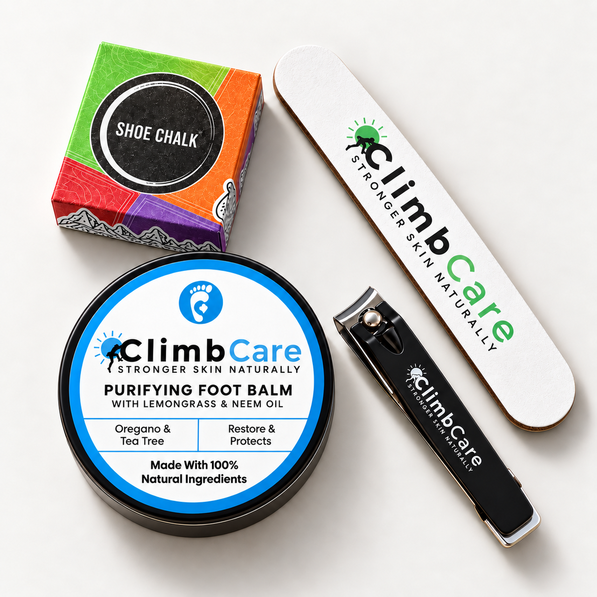 A set of four ClimbCare foot care products arranged on a white background: a shoe chalk box, a tin of purifying foot balm, a nail file, and a nail clipper.